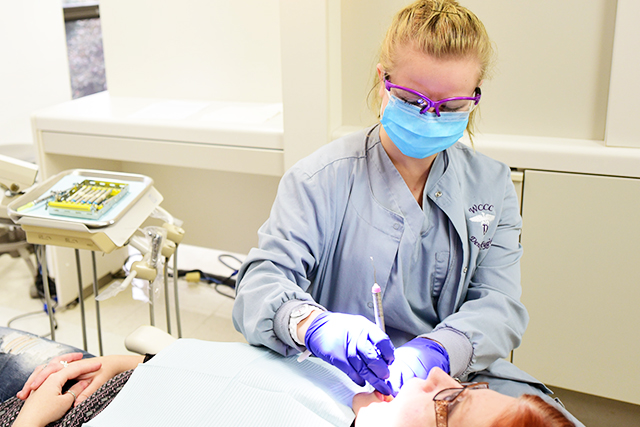 Dental Hygiene student and clinic patient