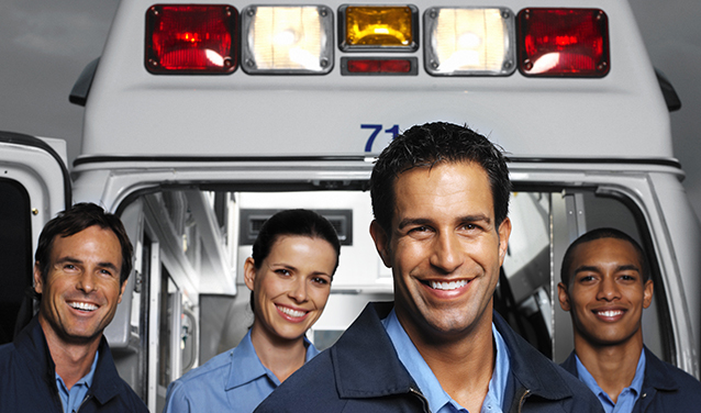 EMTs standing outside ambulance