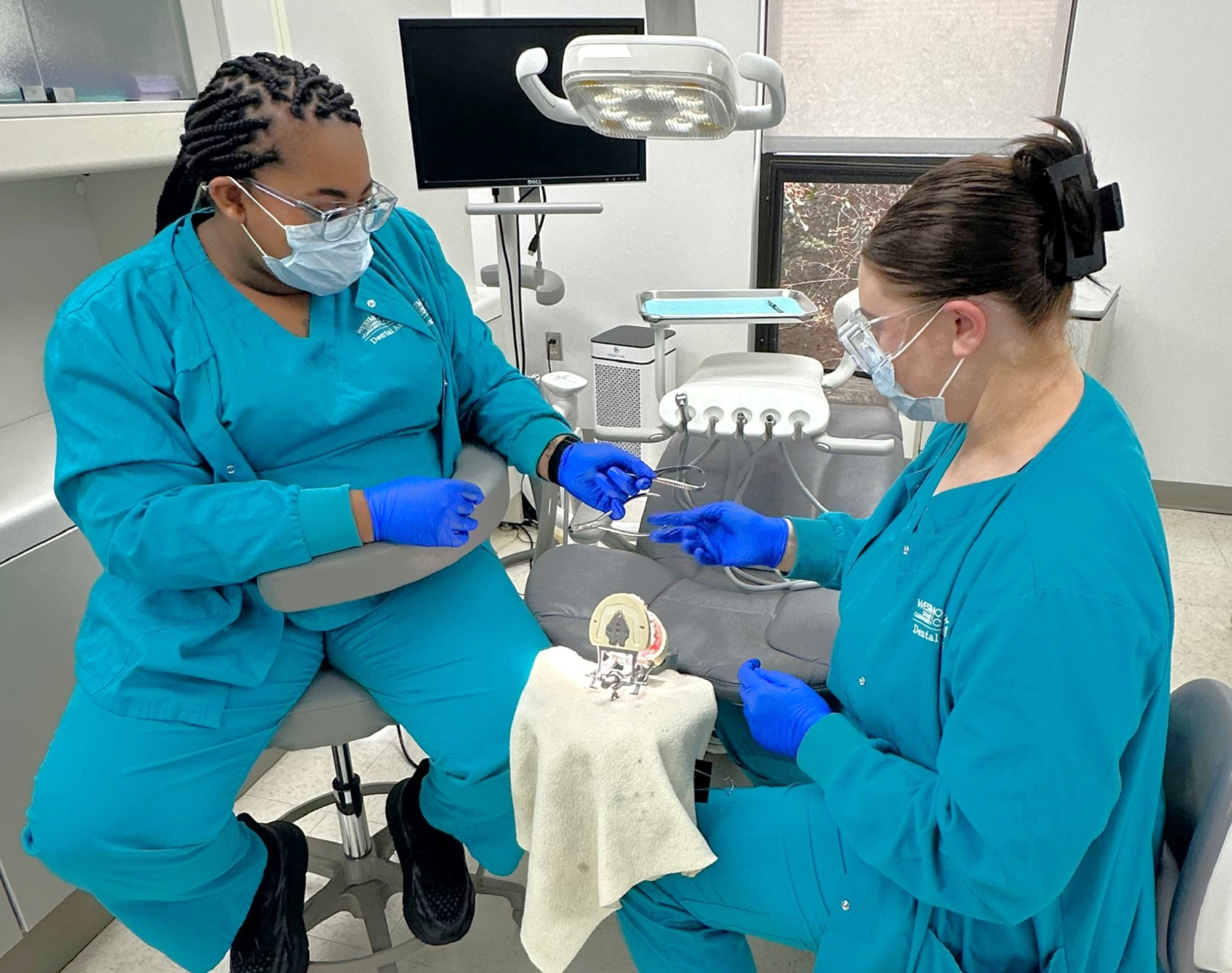 Dental Assisting students with instructor