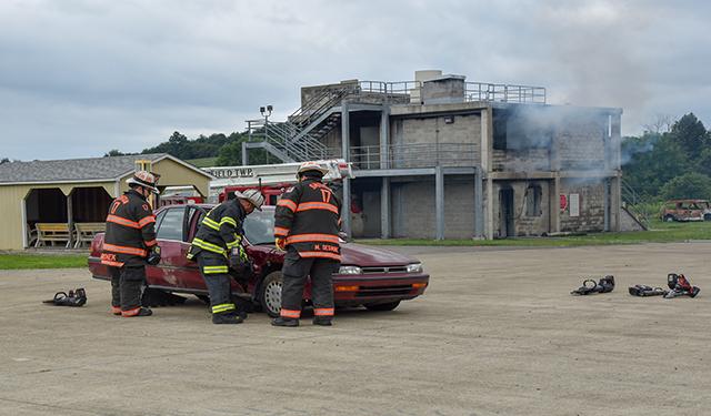 Firefighters demonstrate vehicle rescue techniques at the PSTC. The center offers these courses.