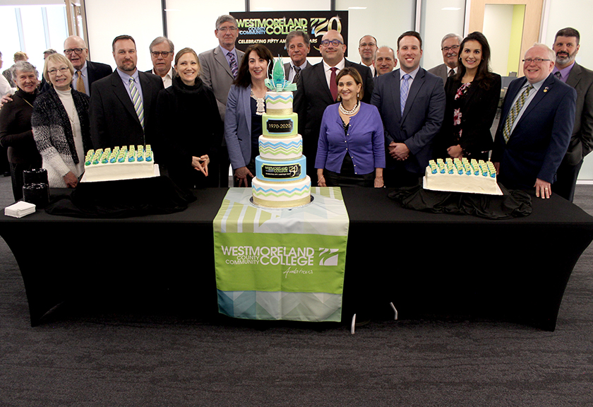 Westmoreland 50th birthday cake with President Stanley, board f trustees members and Educational Foundation board members.