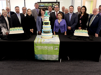 Westmoreland 50th birthday cake with President Stanley, board f trustees members and Educational Foundation board members.