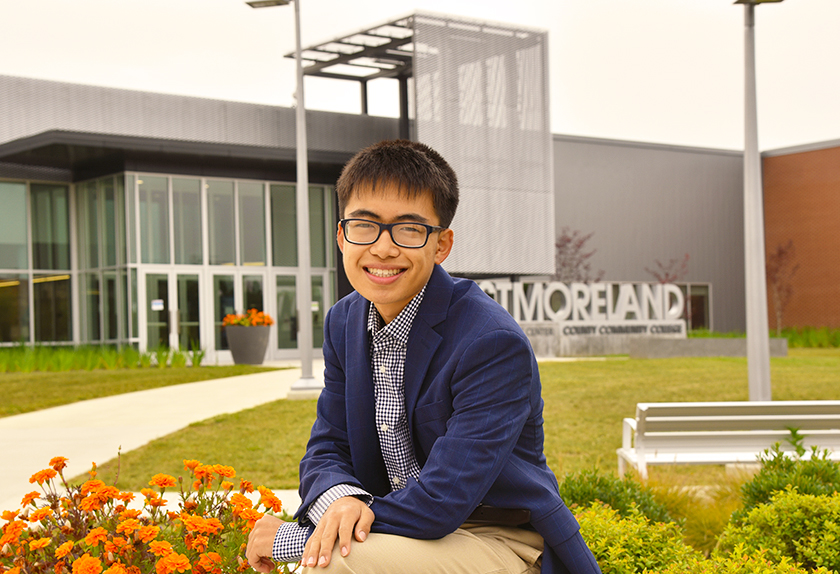 David An sits in front of the Student Achievement Center on Westmoreland's Youngwood campus.