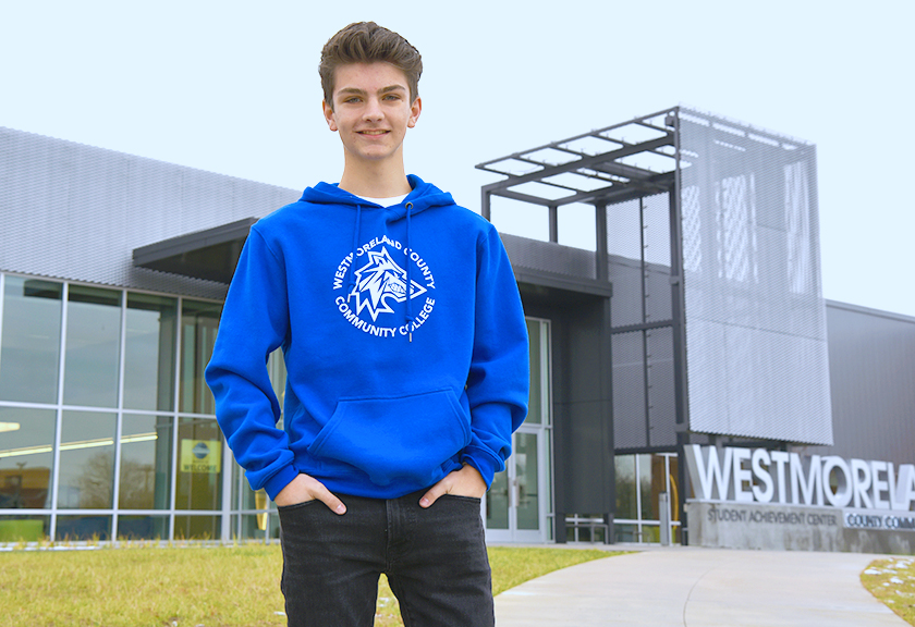 Nate Pangallo stands outside the Student Achievement Center